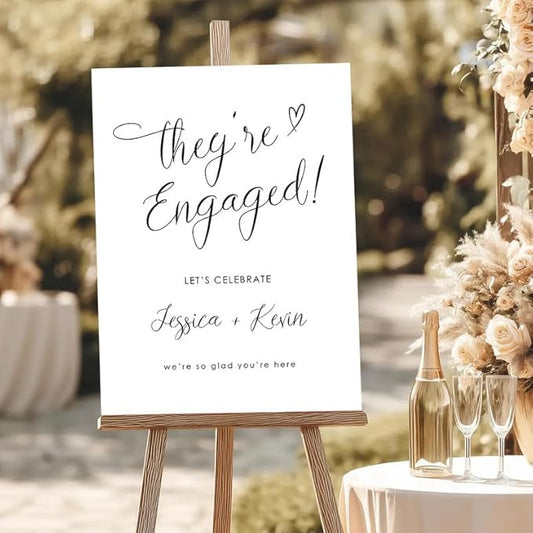 "They're Engaged!" Whimsical Welcome Sign - Modern Cursive Decor for an Engagement Celebration